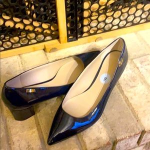 New- Women Navy size 9 mid-heel, pointed toed shoes.